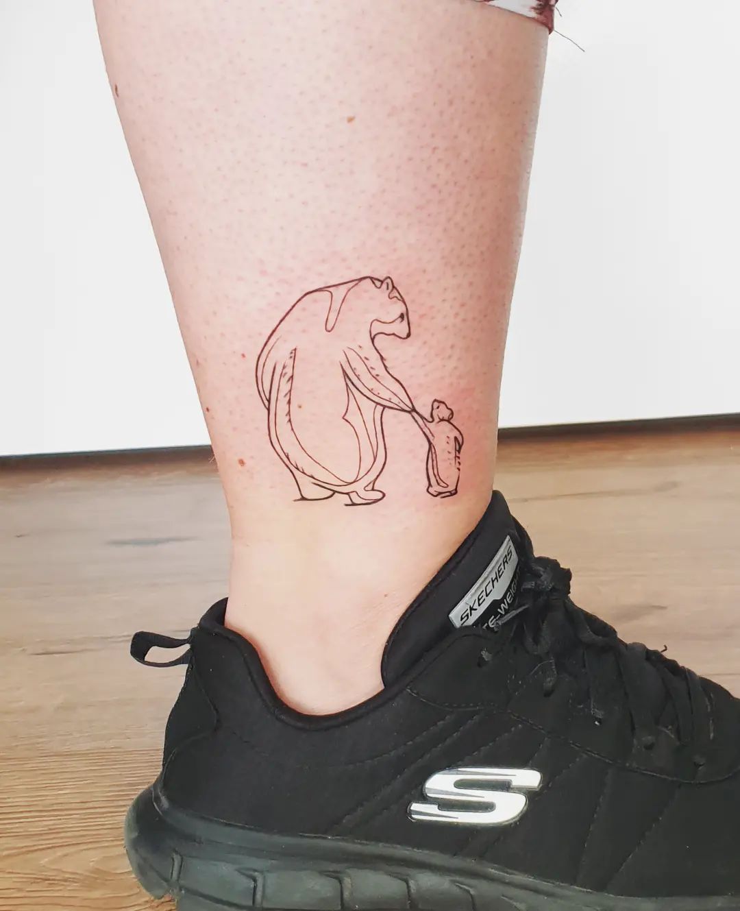 beer met een kind tattoo
